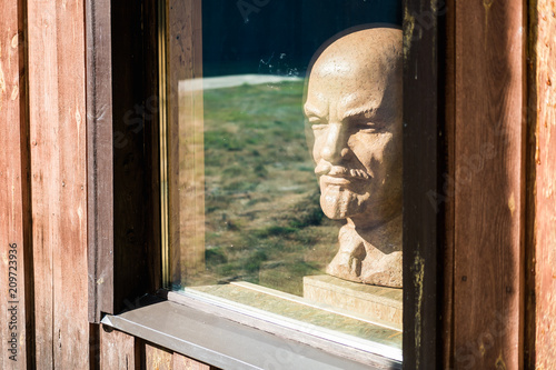 bust of the leader of the proletariat, Lenin looks out of the window