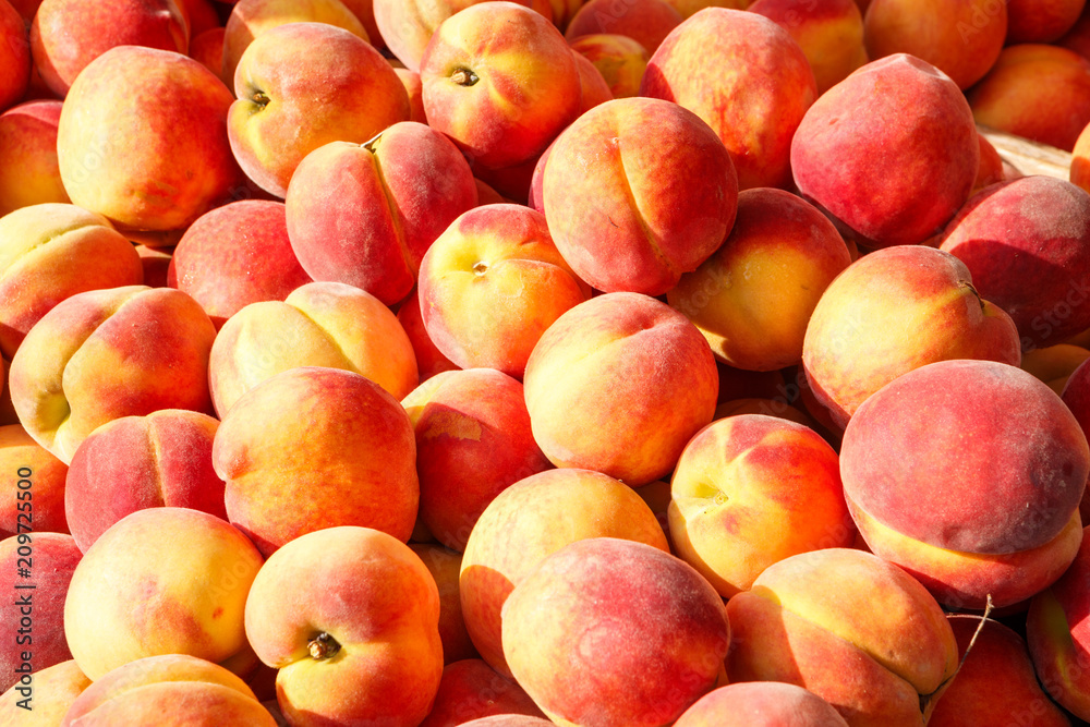 Fresh Picked Peaches at an Outdoor Farmer's Market Fresh Picked Peaches at an Outdoor Farmer's Market