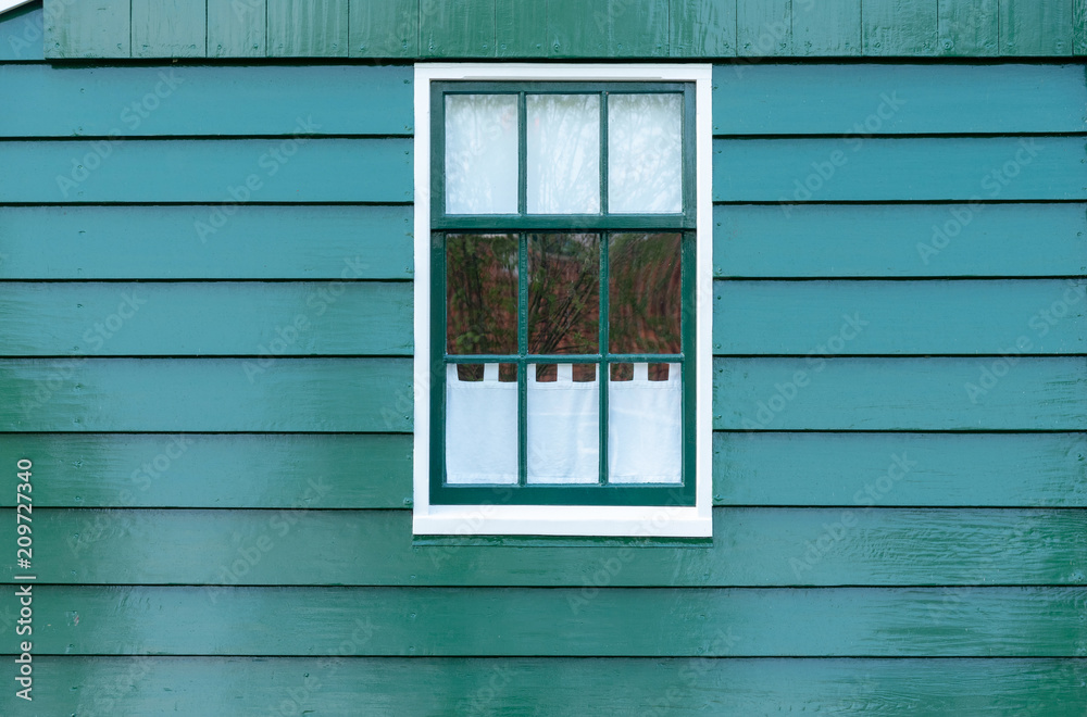 Obraz premium old dutch window on green background
