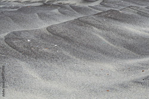 Sand. Small dunes on the beach in Alimini. The Italian coast of the Adriatic sea.