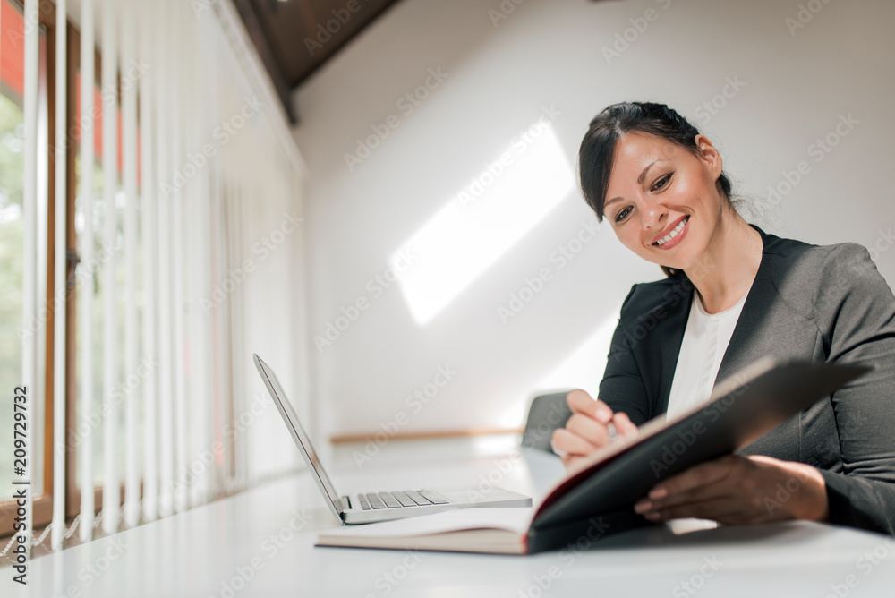 Close-up image of business woman working in the office. Close-up image of business woman working in the office.