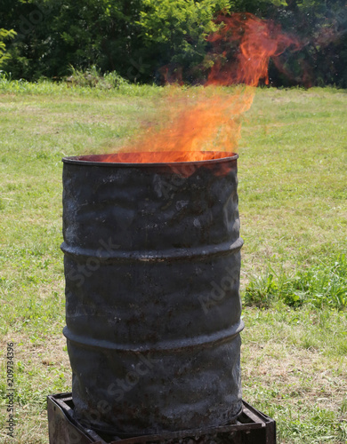 blackened bin with fire inside photo