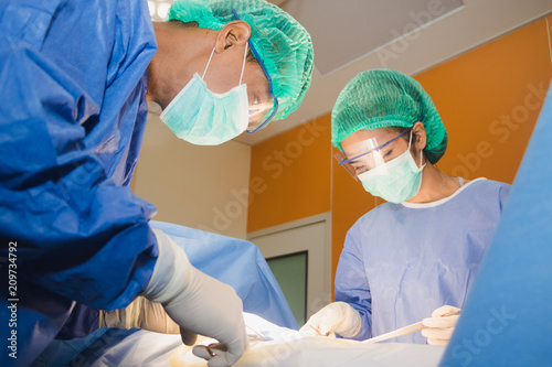 The surgical team is performing surgery for the patients in the operating room