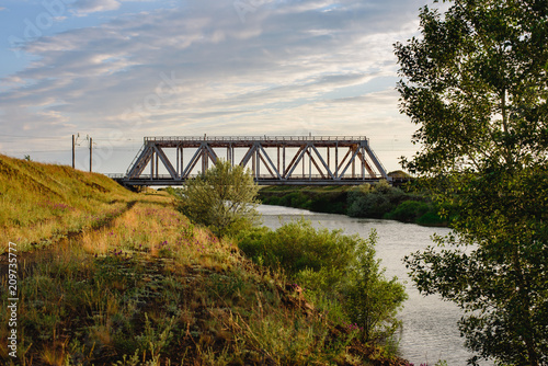 Old metal railway bridge through the water channel © Gennadiy