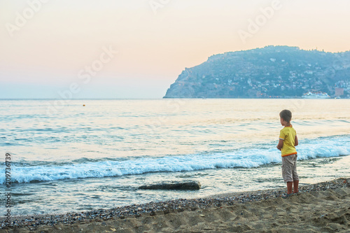 Kid boy walking at Alania b...