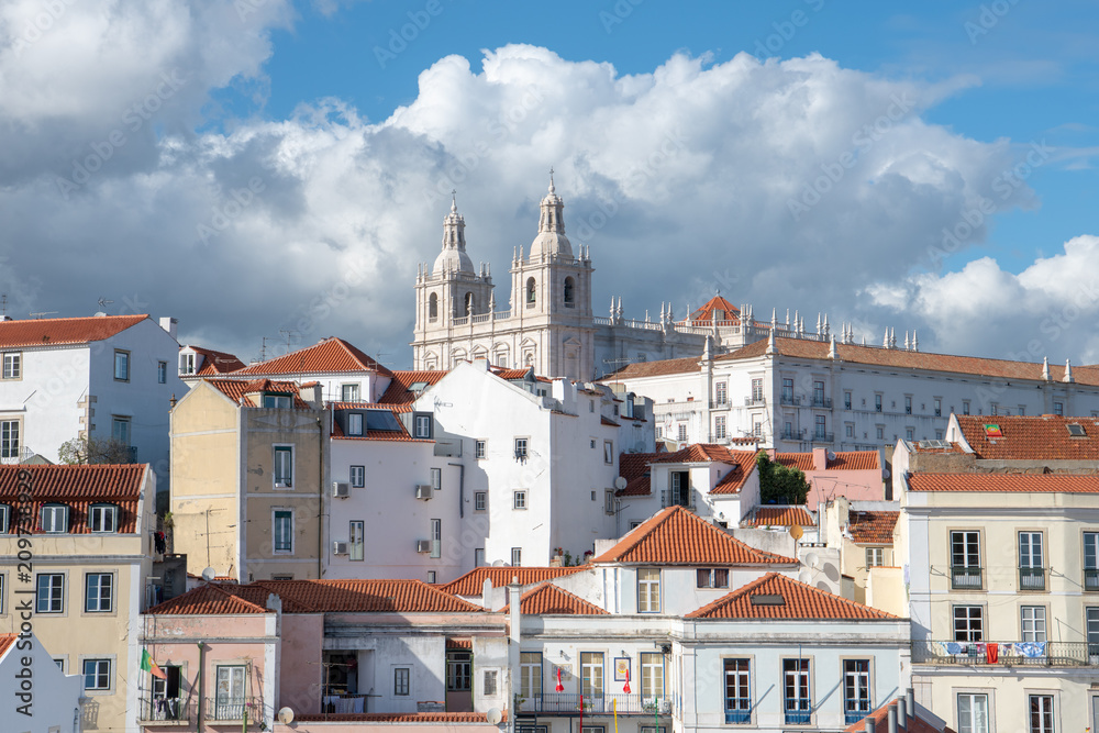 Mosteiro de Sao Vicente de Fora church and monastery above the Alfama district in Lisbon, Portugal under dramatic sky and clouds