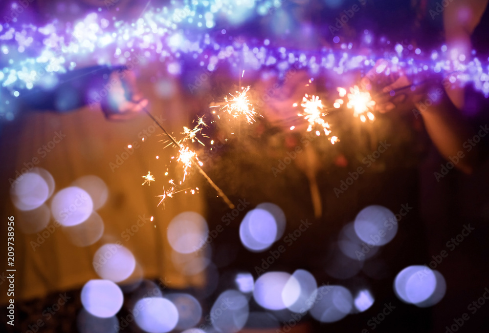 Abstract blurred of Sparklers with group of friends having fun for