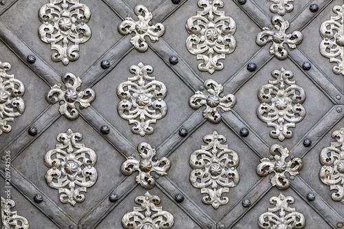 Historic ironwork at a door in Prague