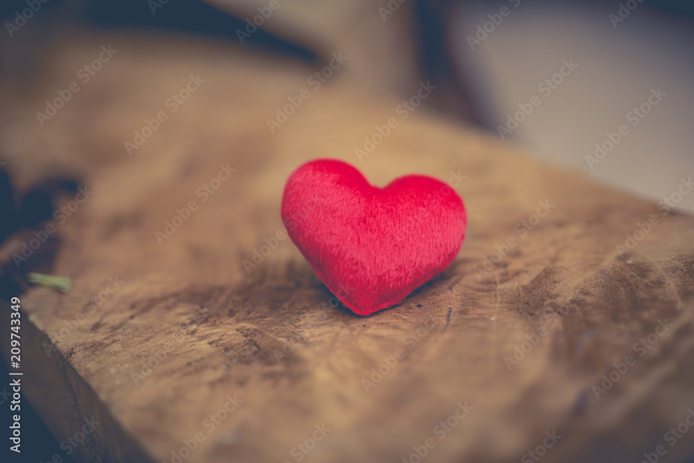 Red heart shape on wooden board. Red heart shape on wooden board.