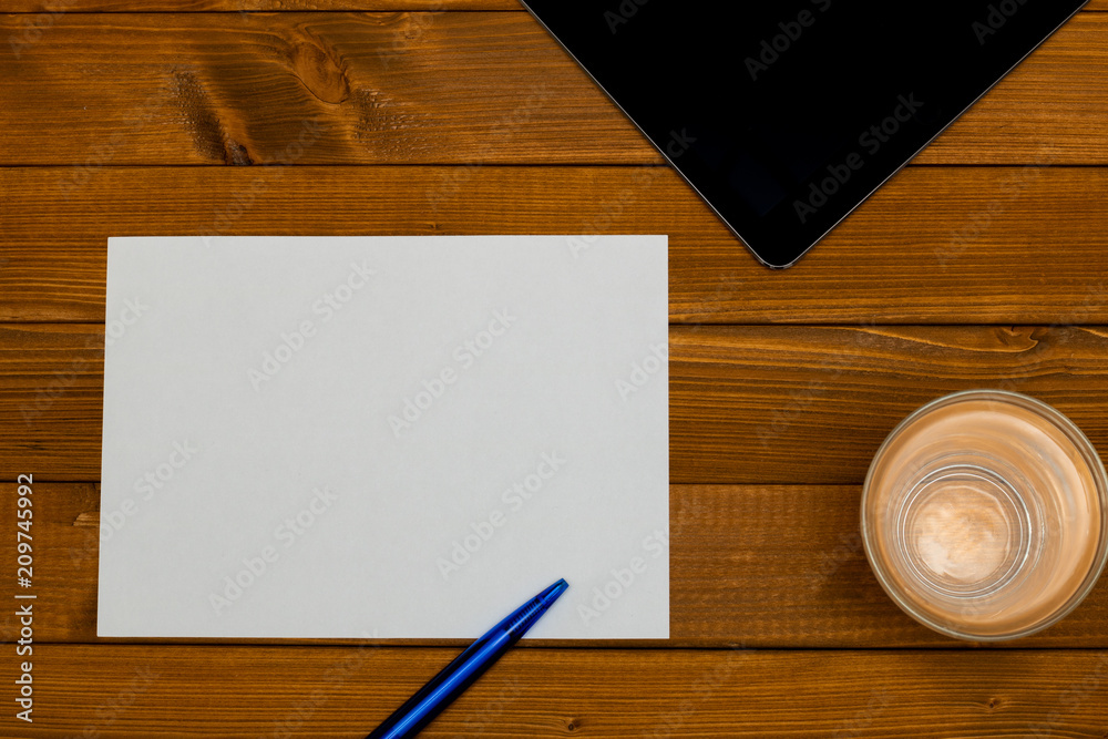 Top view - workplace with a blank paper Top view - workplace with a blank paper