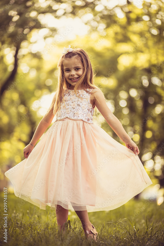 Portrait of beautiful little girl at nature. Spring season.