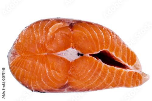 Fresh salmon steak isolated on the white background. Salmon Red Fish Steak. Large Pile of trout steak. Big organic steaks of salmon lined up. Big pieces raw salmon.