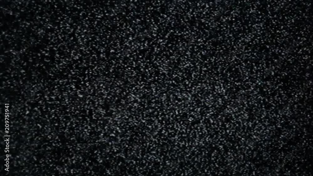 Angled capture: static flickering noise from an old analog tv screen.
