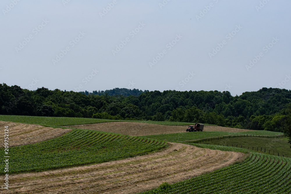 Rural Appalachia farmer harvesting haylage