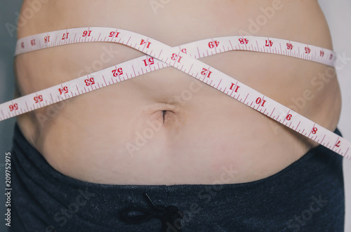 Human body and fat body part of paunch or belly and overweight of people. photo