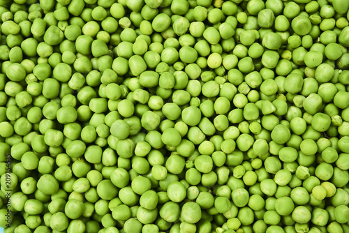 Fresh green peas background texture top view 