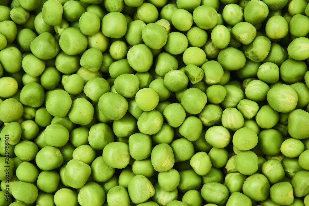 Fresh green peas background texture top view
