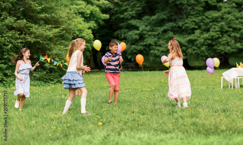 Photography friendship, childhood, leisure and people concept - group of happy kids or frien