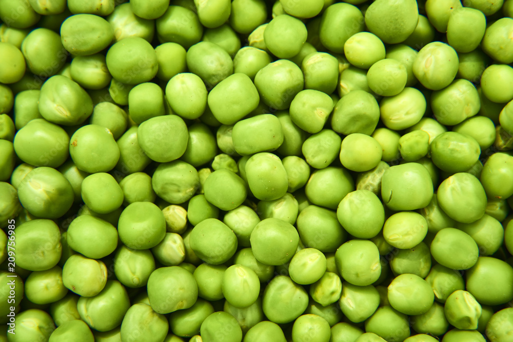 Fresh green peas background texture top view
