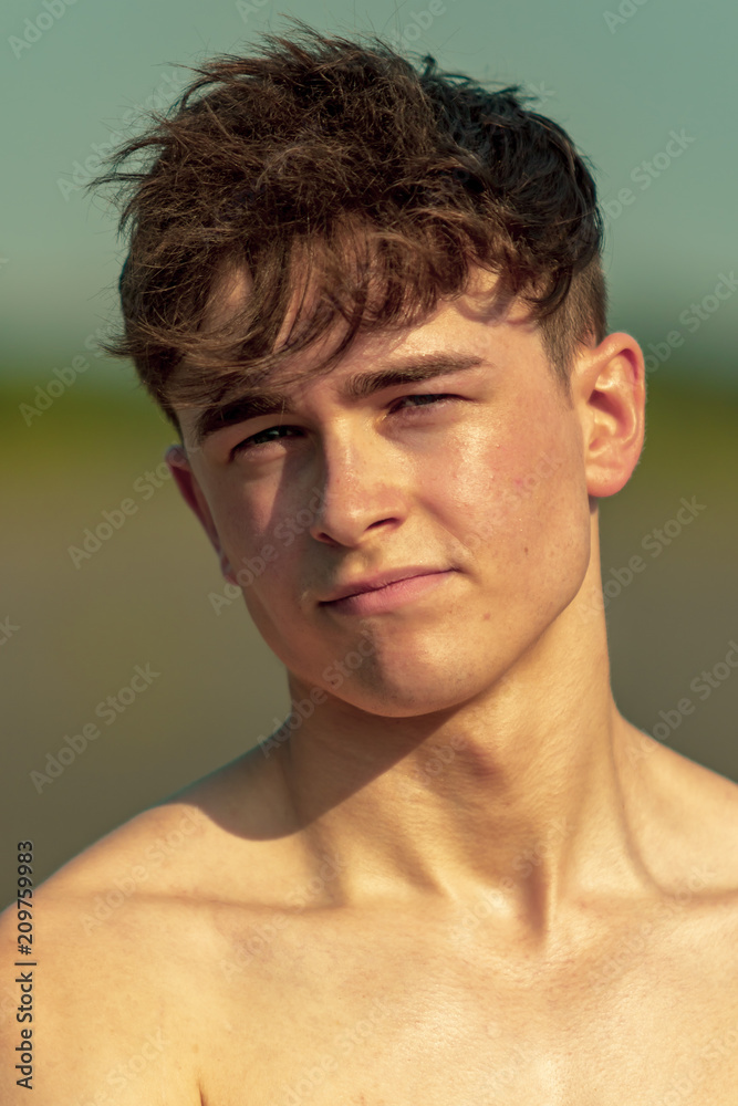 Young adult male shirtless outdoors Young adult male shirtless outdoors