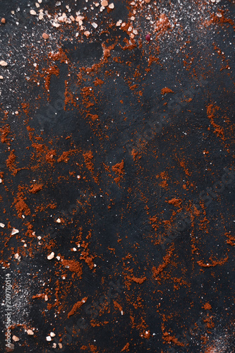 organic spice mix on dark background. food cooking and condiments concept. copyspace
