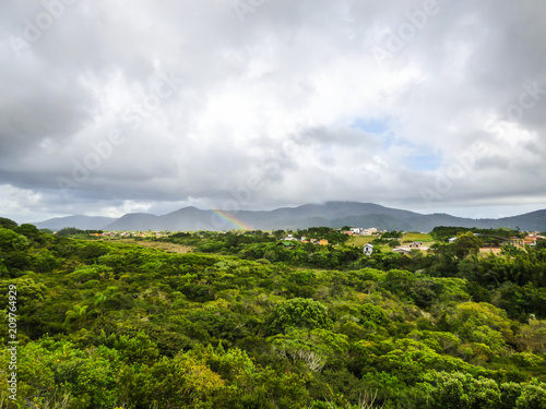 Rainbow over the Atlantic Forest in Florianopolis, Brazil photo