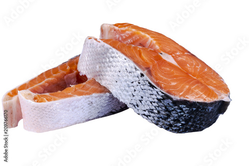 Fresh salmon steak isolated on the white background. Salmon Red Fish Steak. Large Pile of trout steak. Big organic steaks of salmon lined up. Big pieces raw salmon.