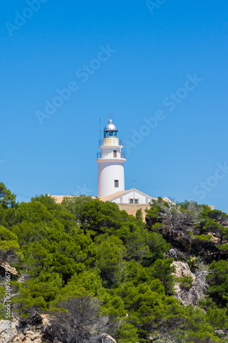 Mallorca, Green forest surrounding ancient lighthouse of cape capdepera