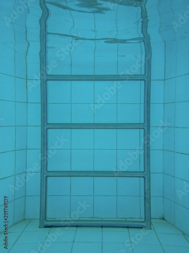 metal stair under water in the pool