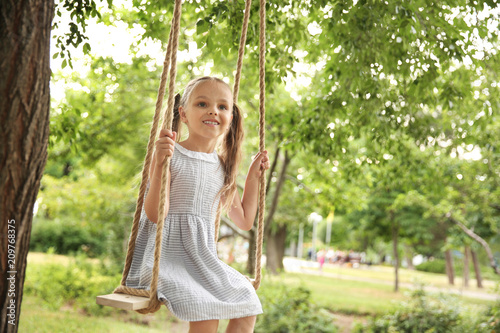 Cute little girl playing on...