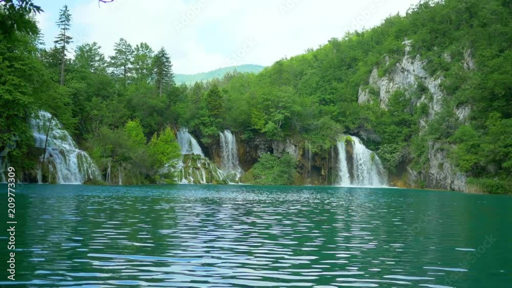 Wide shot of a beautiful waterfall and lake at Plitvice Lakes Wide shot of a beautiful waterfall and lake at Plitvice Lakes