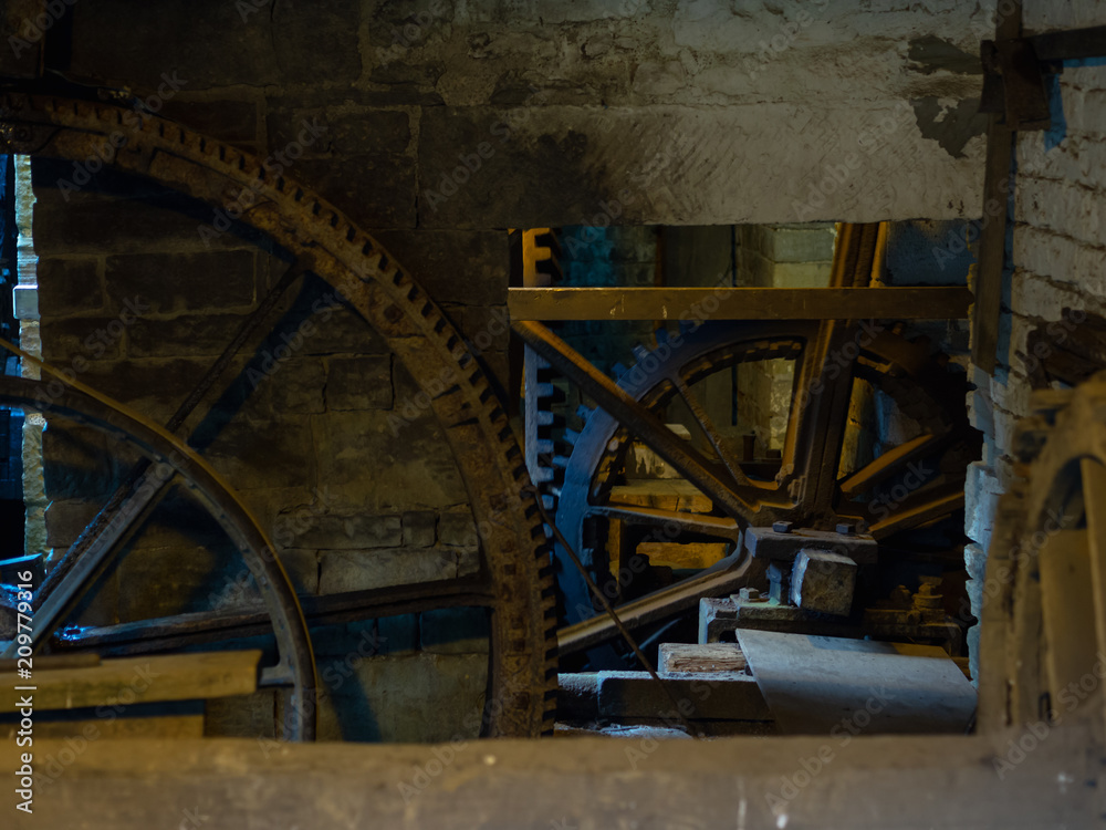 Rustic scene with giant cogwheels and gears