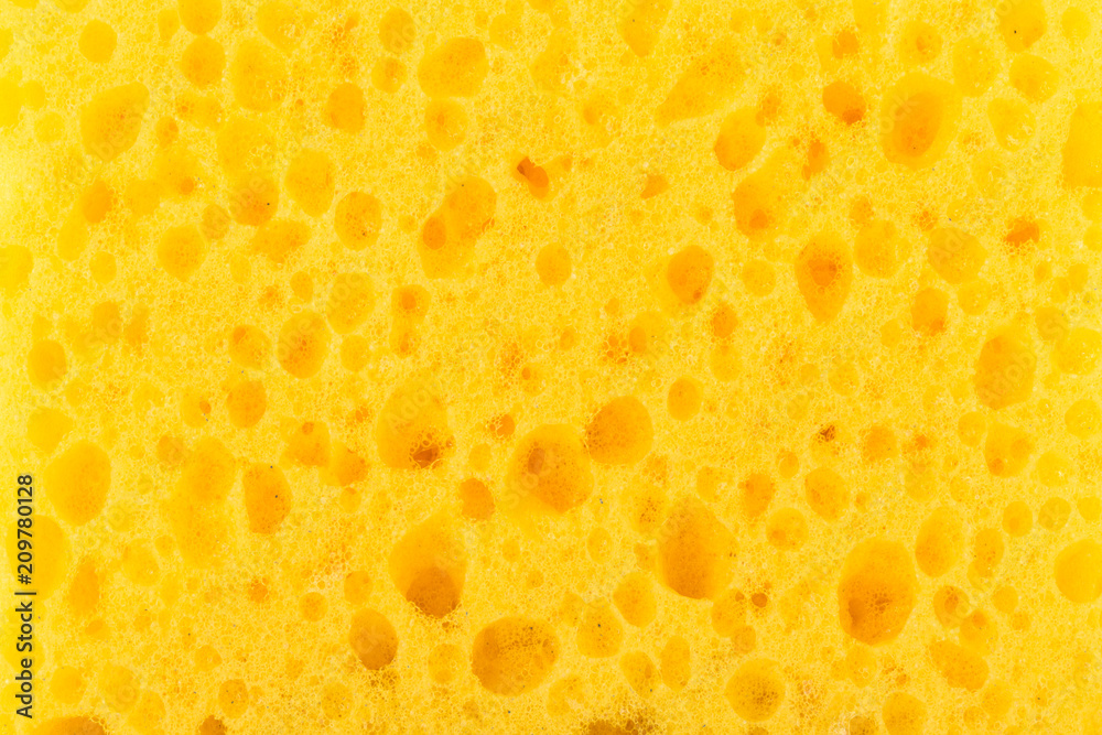 texture yellow foam rubber, synthetic sponge with large pores, close-up background texture yellow foam rubber, synthetic sponge with large pores, close-up background