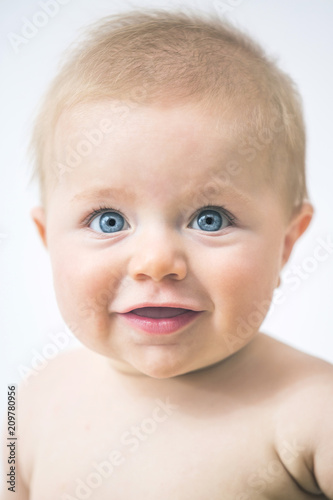 Adorable Blond Baby with Blue Eyes