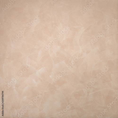 Textured background. Decorative plaster walls, external decoration of facade. Texture of beige © bubligg