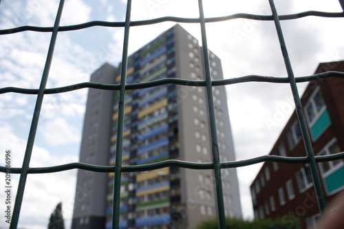 High rise building behind fence