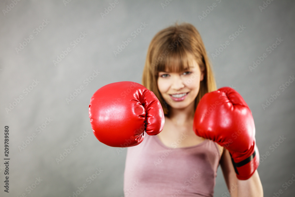 Woman wearing boxing gloves Woman wearing boxing gloves