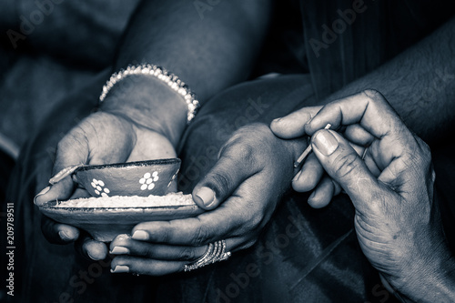 Old woman holding Deya during Hindu Cultural Diwali Celebration