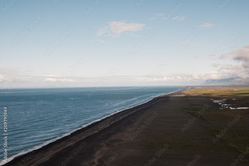 Shore with cliff shadow in iceland Shore with cliff shadow in iceland