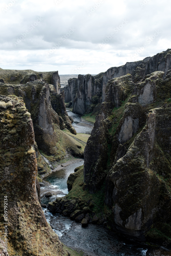 Back view of huge canyon with river in iceland