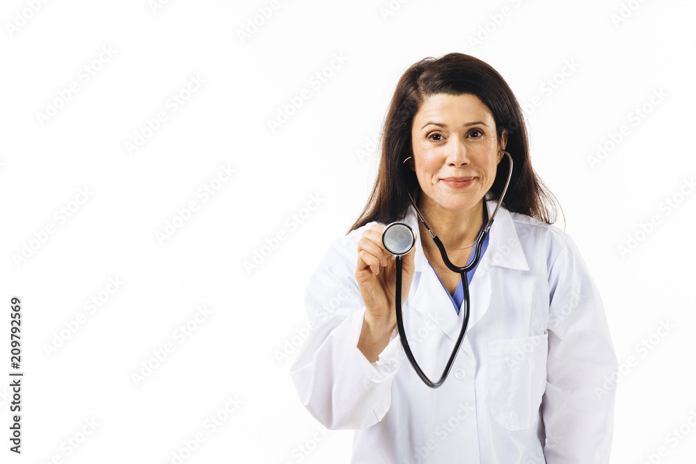 Portrait of a friendly smiling female doctor holding stethoscope and looking at camera, isolated on white studio background Portrait of a friendly smiling female doctor holding stethoscope and looking at camera, isolated on white studio background