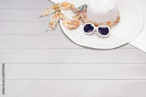 Summer accessories, vacation, travel, holiday top view background. Female accessories assortment. Womans hat and frame composition. Summertime and tourism concept