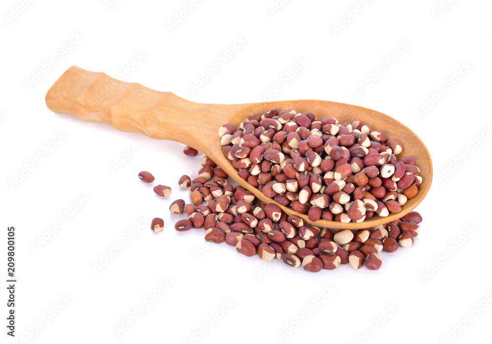 cow peas in wooden spoon on white background cow peas in wooden spoon on white background