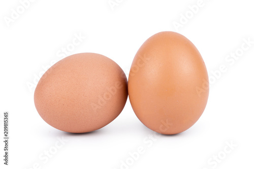 Two brown eggs isolated on white background cutout