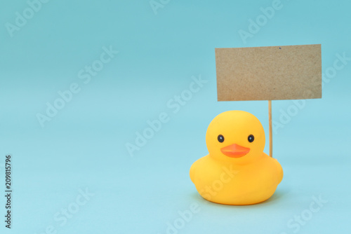 Feedback concept, rubber ducks are holding blank signboard