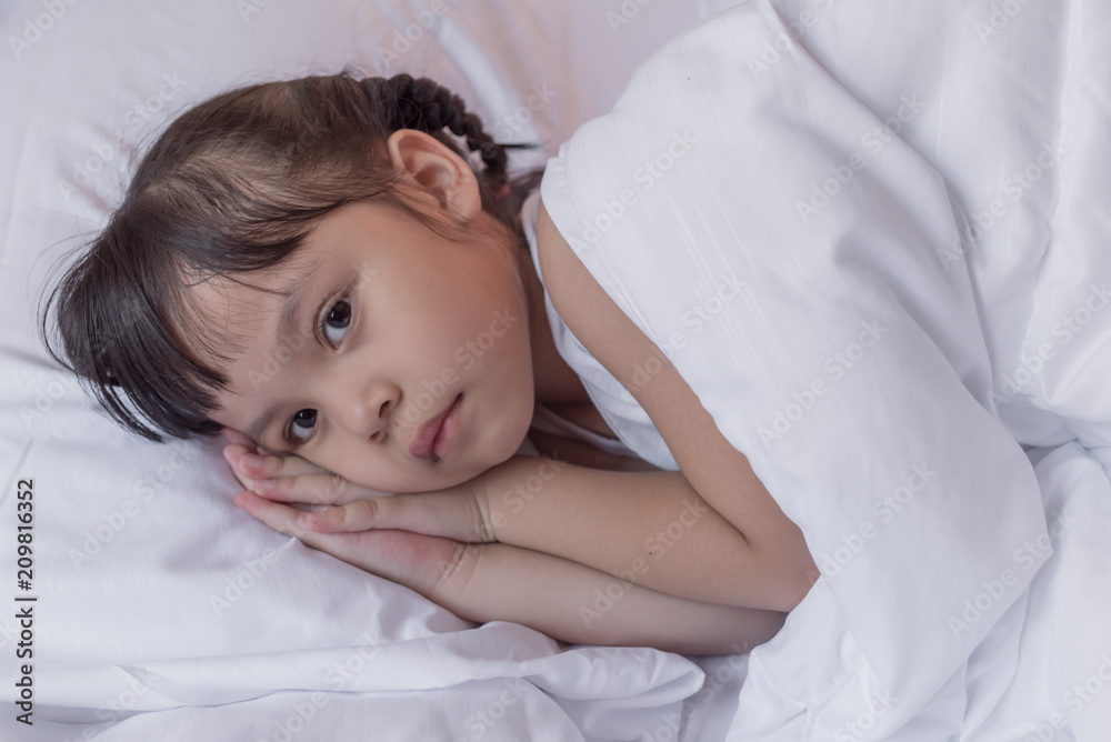 health and beauty concept - little girl sleeping at home health and beauty concept - little girl sleeping at home