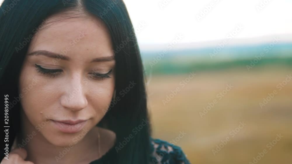 pretty girl brunette portrait large lips wind develops hair portrait slow motion video. brunette woman girl hair hairstyle lips strong wind on the nature. girl lips lifestyle wind hair concept pretty girl brunette portrait large lips wind develops hair portrait slow motion video. brunette woman girl hair hairstyle lips strong wind on the nature. girl lips lifestyle wind hair concept