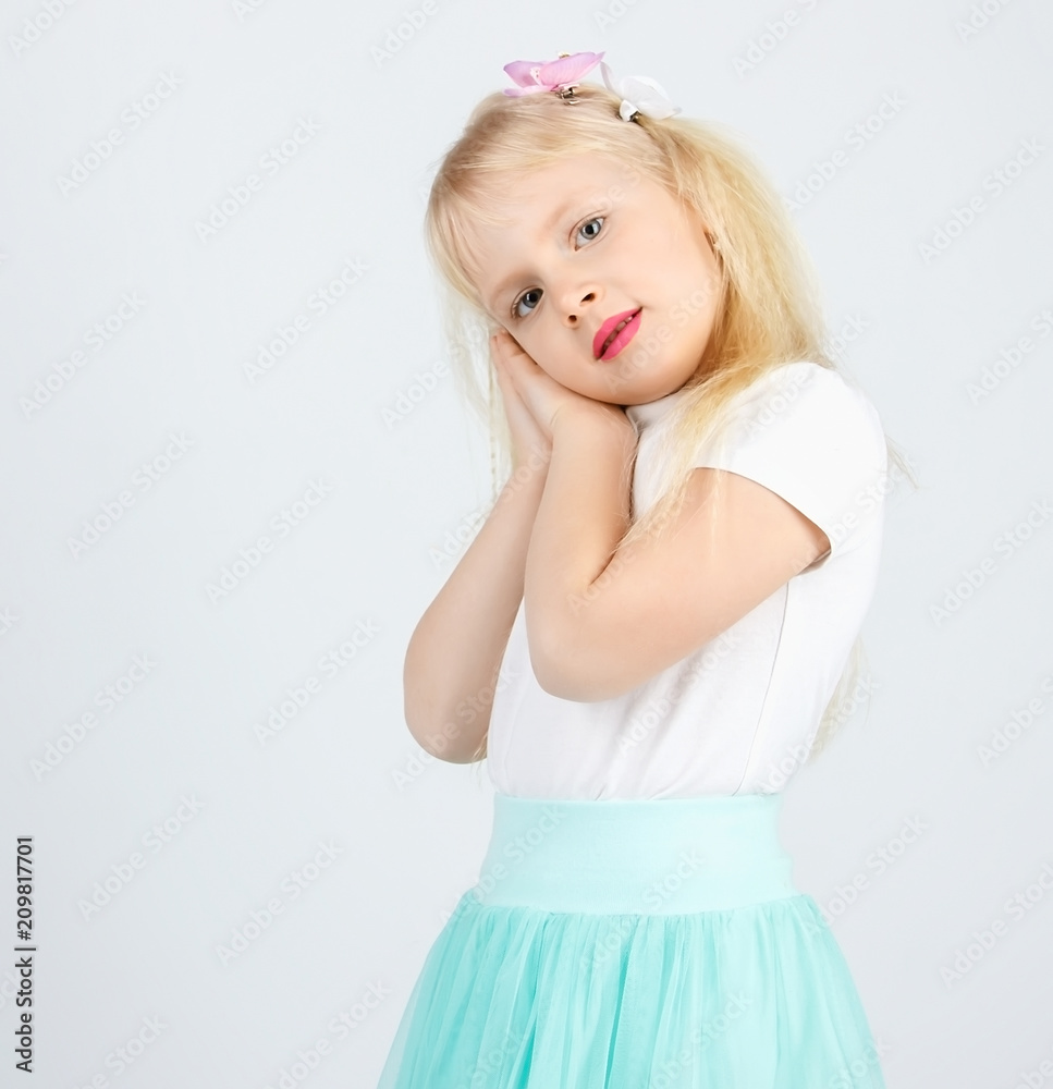 the little blonde girl folded her arms. A little angel the little blonde girl folded her arms. A little angel