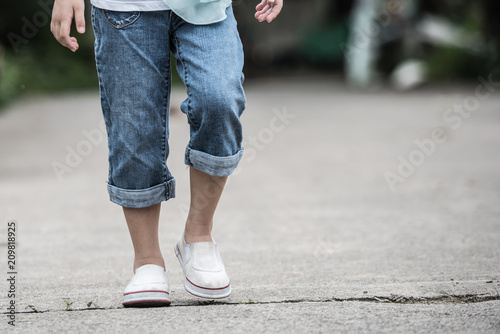 Woman jeans and sneaker shoes