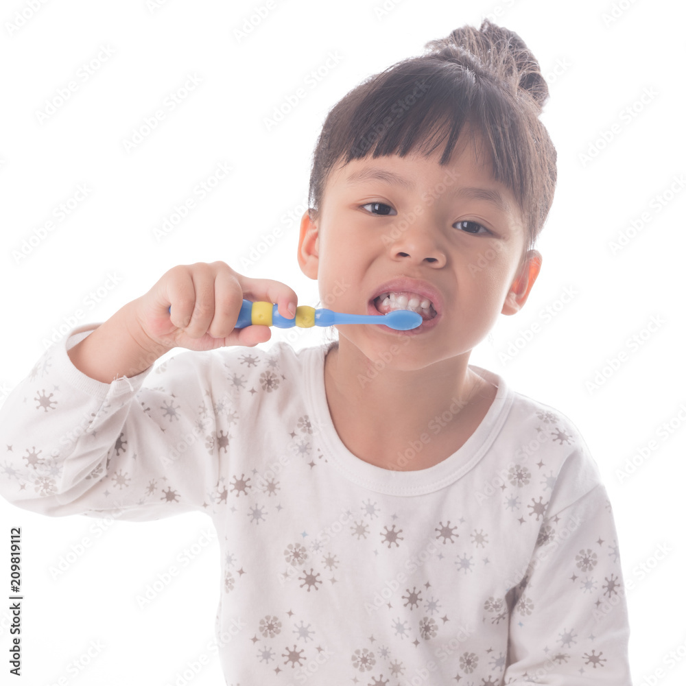 Little girl brushing her teeth isolated on white background Little girl brushing her teeth isolated on white background